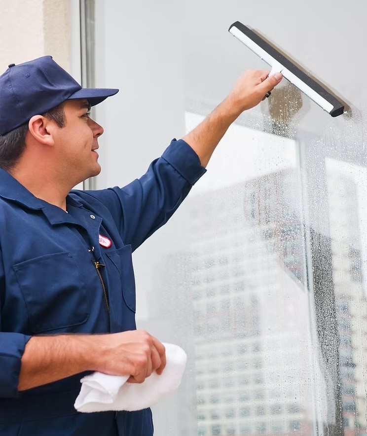 Vaz Pro technician cleaning a window